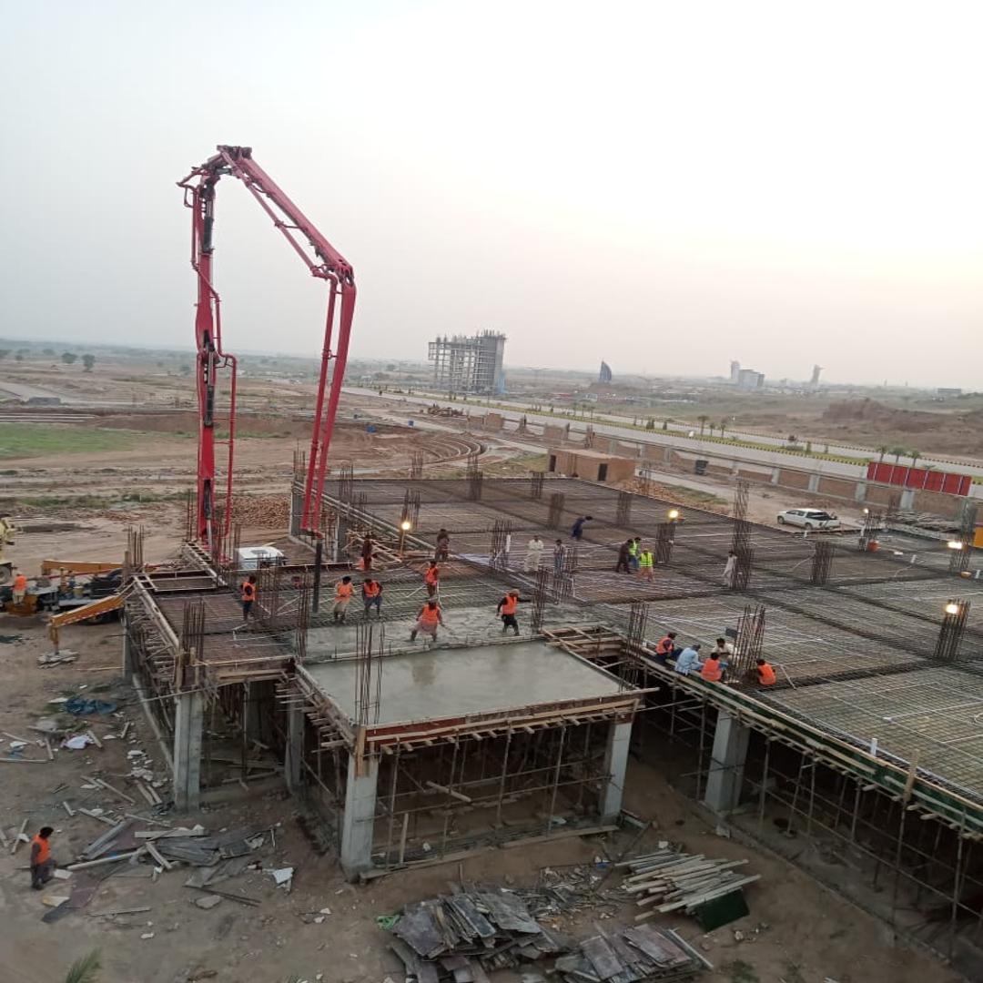 Concrete slab pouring in progress on a construction site