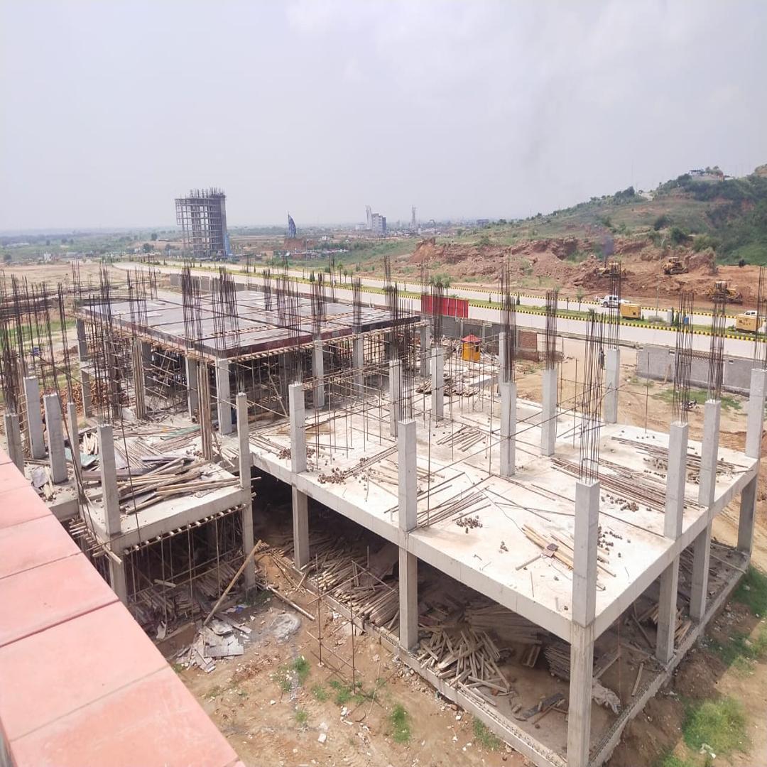 Expansive grey structure construction site in Islamabad